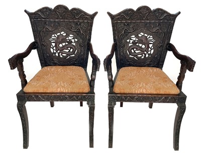 Lot 231 - A pair of Chinese carved hardwood armchairs, 19th century.