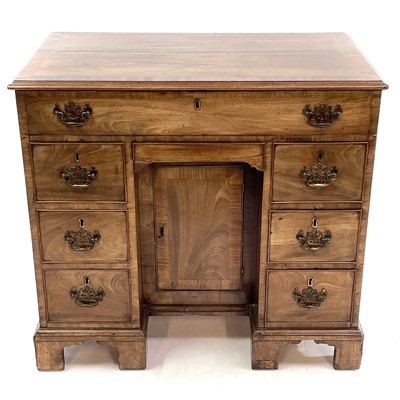 Lot 1802 - A George III mahogany kneehole gentleman's dressing table/writing desk.