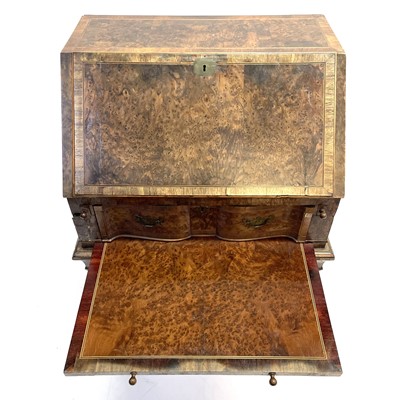 Lot 31 - A Queen Anne style burr yew and elm banded small writing bureau.