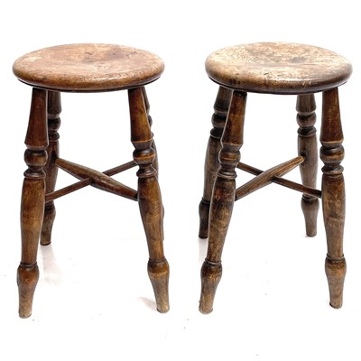 Lot 91 - Two Victorian elm circular top stools.