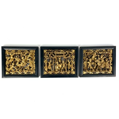 Lot 144 - Three Chinese carved giltwood panels, mid 20th...
