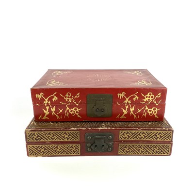 Lot 450 - Two Chinese red painted and gilt decorated leather boxes, mid 20th century