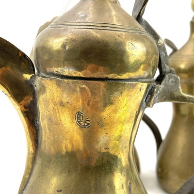 Lot 1066 - A late 19th century brass dallah pot, with stamped mark to neck.