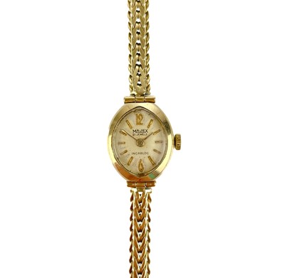 Lot 472 - A 1960's 9ct gold ladies manual wind bracelet wristwatch.