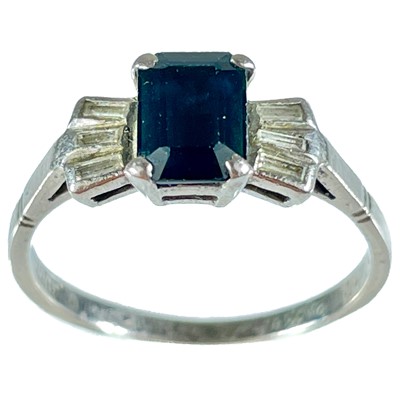 Lot 58 - An 18ct white gold diamond and sapphire set ring.