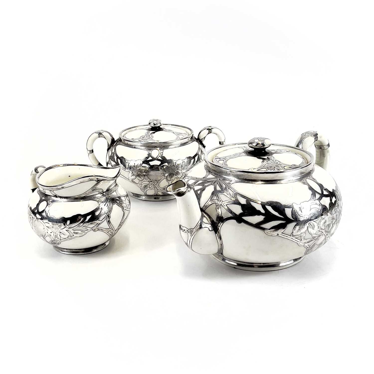 Lot 872 A Royal Doulton white glazed silver overlaid