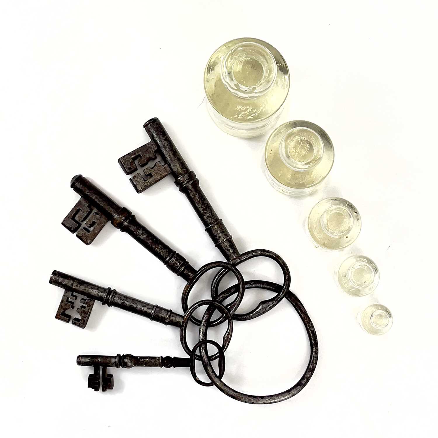 Lot 114 - A group of four large Georgian steel keys on