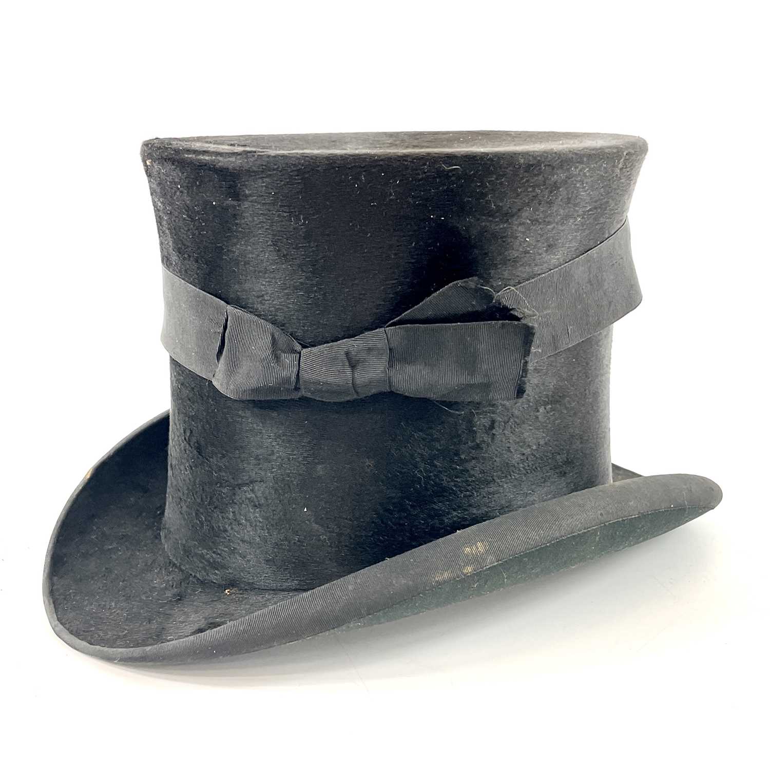 Lot 113 - A Victorian silk top hat and leather case.