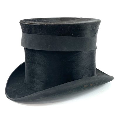 Lot 113 - A Victorian silk top hat and leather case.