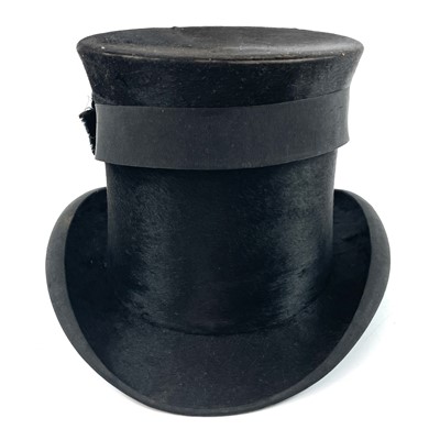 Lot 113 - A Victorian silk top hat and leather case.