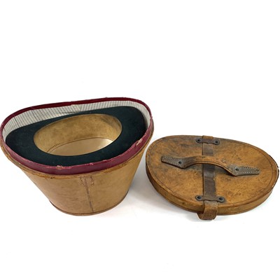 Lot 113 - A Victorian silk top hat and leather case.