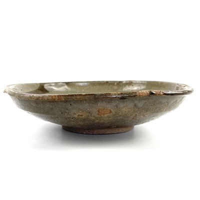 Lot 462 - A Japanese pottery glazed dish, 18th/19th century.