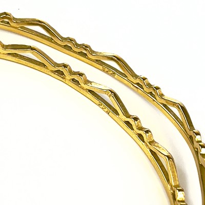 Lot 1 - An Indian 22ct gold pair of bangles.