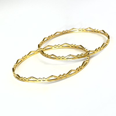 Lot 1 - An Indian 22ct gold pair of bangles.