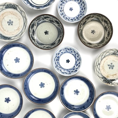 Lot 352 - Fourteen Japanese Nabeshima blue and white porcelain dishes, 18th/19th century.