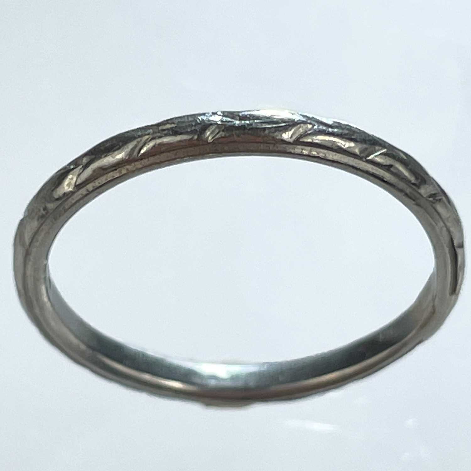 Lot 191 - A platinum band ring.