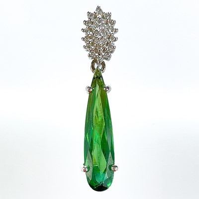 Lot 234 - A stylish 18ct white gold Santa Rosa green tourmaline 18ct and diamond set pendant.