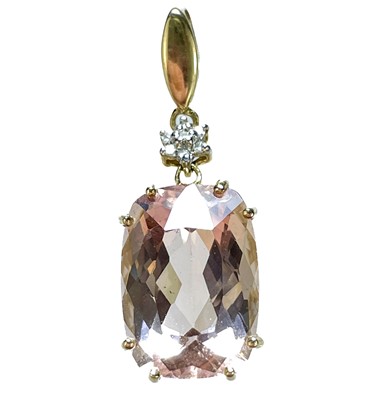 Lot 37 - A modern 9ct gold morganite and diamond set pendant.