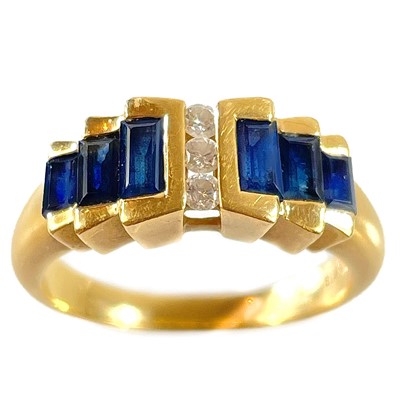 Lot 356 - A modern 18ct gold diamond and sapphire dress ring.