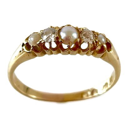 Lot 144 - An Edwardian 18ct diamond and split pearl five stone ring.