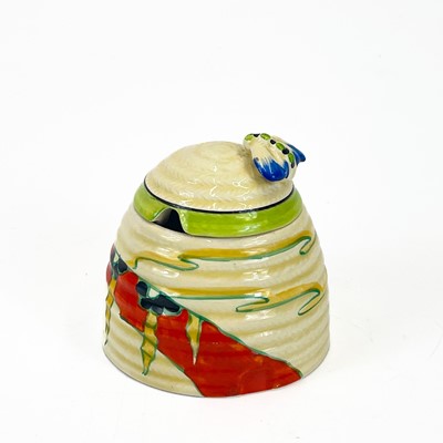 Lot 458 - A Clarice Cliff Fantastique beehive honey pot and cover.