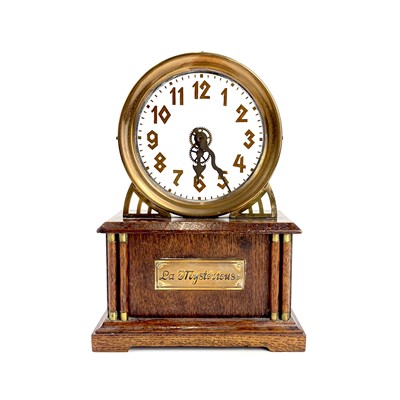 Lot 1713 - An American La Mysterieuse oak and brass cased mystery mantel clock.