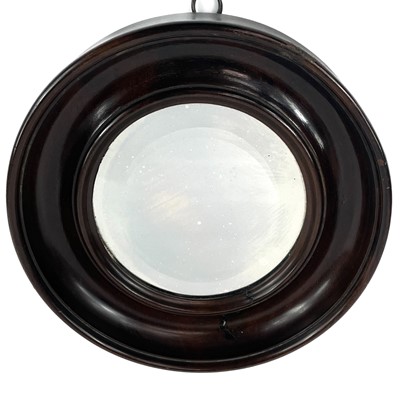 Lot 40 - A small late 19th century circular bevelled edge mirror in a mahogany frame.