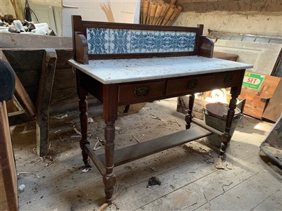 Lot 429c - A marble top washdown with low tiled back.