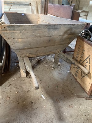 Lot 429 - A massive wooden wheelbarrow with solid wooden...