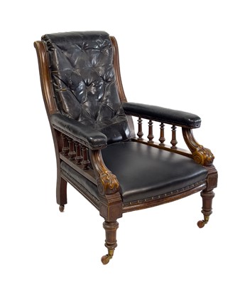 Lot 1917 - A Victorian leather upholstered walnut armchair.