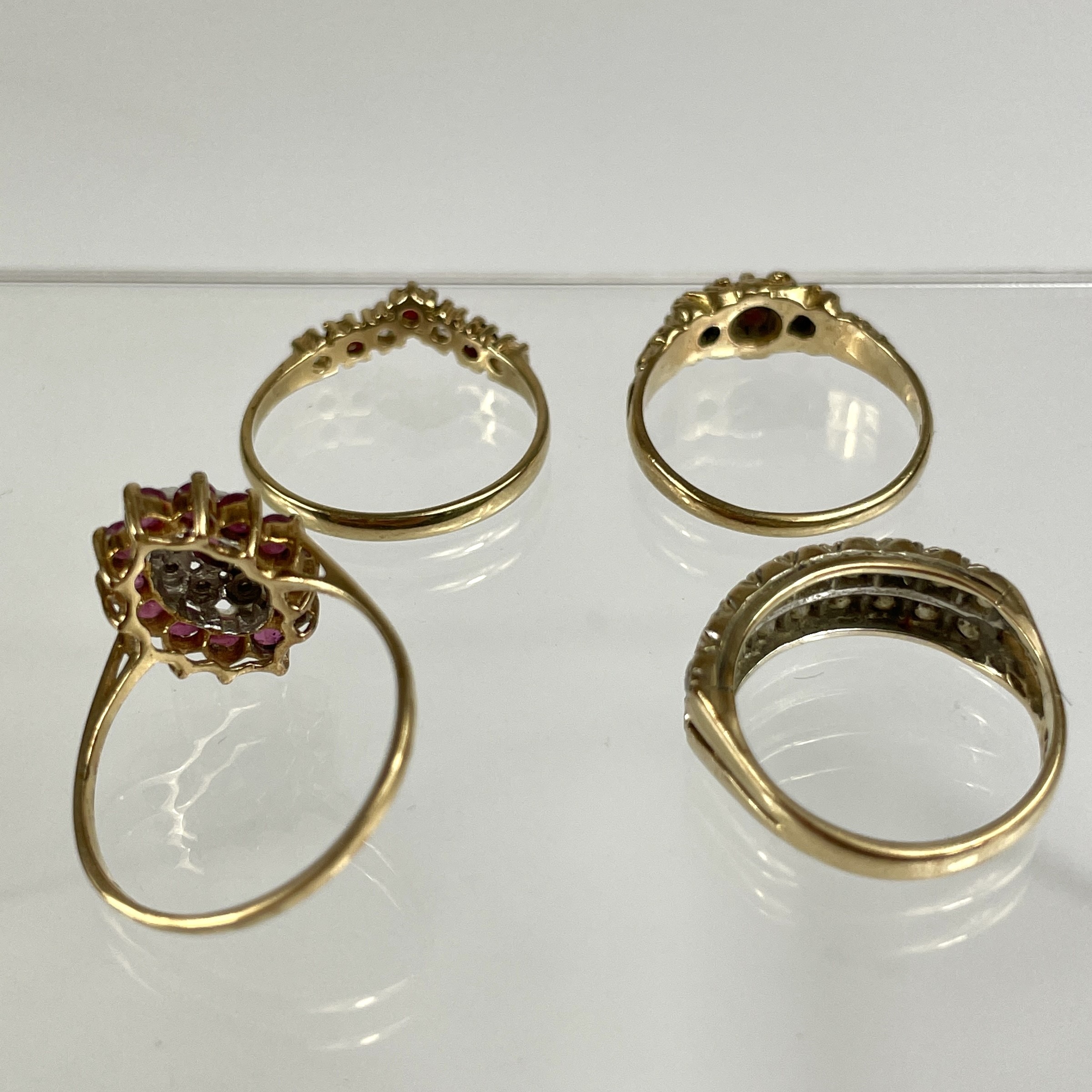 Lot 60 - Four 9ct gold stone set rings.