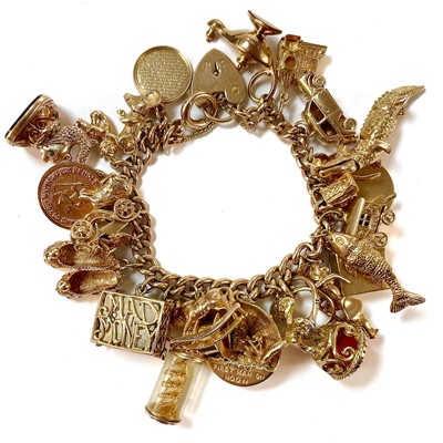 Lot 340 - A good 9ct charm bracelet with numerous 9ct and gold charms.