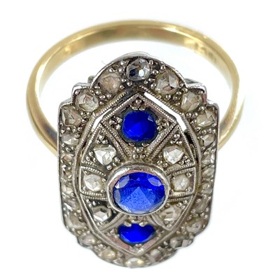 Lot 175 - A stylish Art Deco period 18ct yellow and white gold diamond and sapphire panel ring.