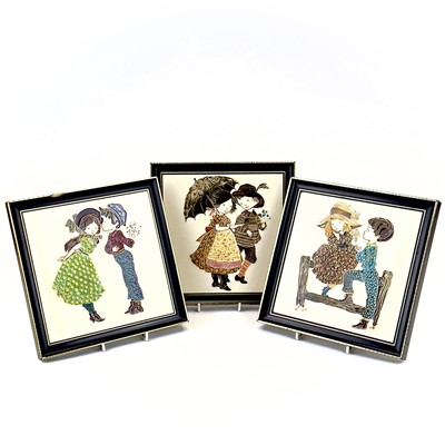 Lot 889 - Three Maw & Co framed tiles depicting young couples.