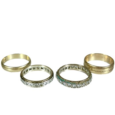 Lot 283 - Two 9ct band rings and two white stone set full eternity rings.