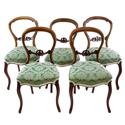 Lot 1862 - A set of three Victorian walnut balloon back dining chairs.