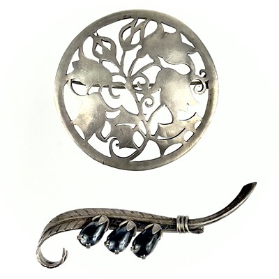 Lot 307 - A  German 800 silver circular brooch and a feather design brooch.