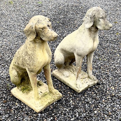 Lot 600 - A pair of reconstituted stone figures of Pointer type dogs.