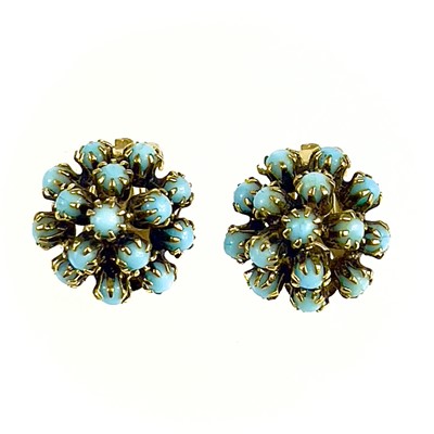 Lot 551 - A Christian Dior 1960's pair of gilt metal and blue stone set clip earrings.