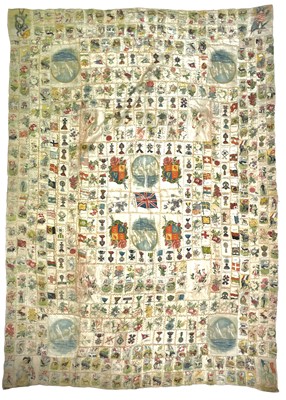 Lot 1602 - A collection of cigarette card silks - various subjects - made into a quilt.