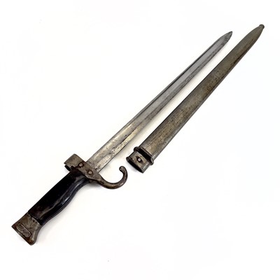 Lot 115 - A WWI bayonet and scabbard.