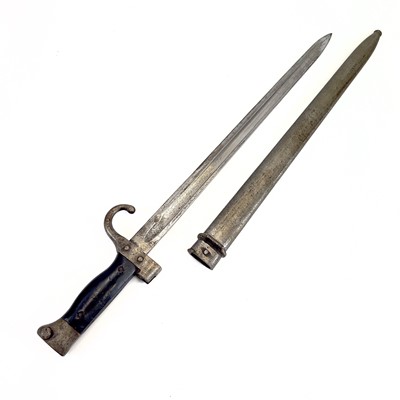 Lot 115 - A WWI bayonet and scabbard.