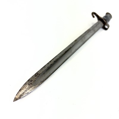 Lot 115 - A WWI bayonet and scabbard.