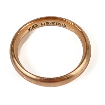 Lot 186 - A 1920's 9ct rose gold band ring.