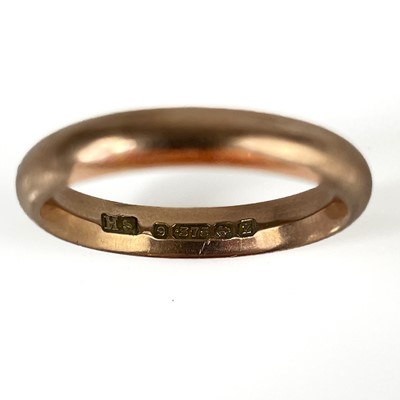 Lot 186 - A 1920's 9ct rose gold band ring.