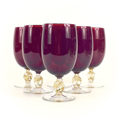 Lot 844 - A set of eight Venetian glass wine glasses.