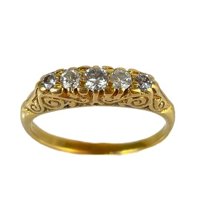 Lot 124 - An Edwardian gold diamond set five stone ring.