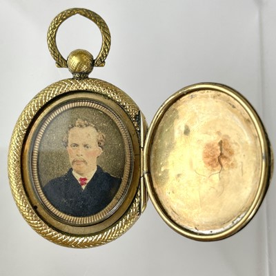 Lot 170 - A Victorian gold front and back locket pendant and a gold locket fob.