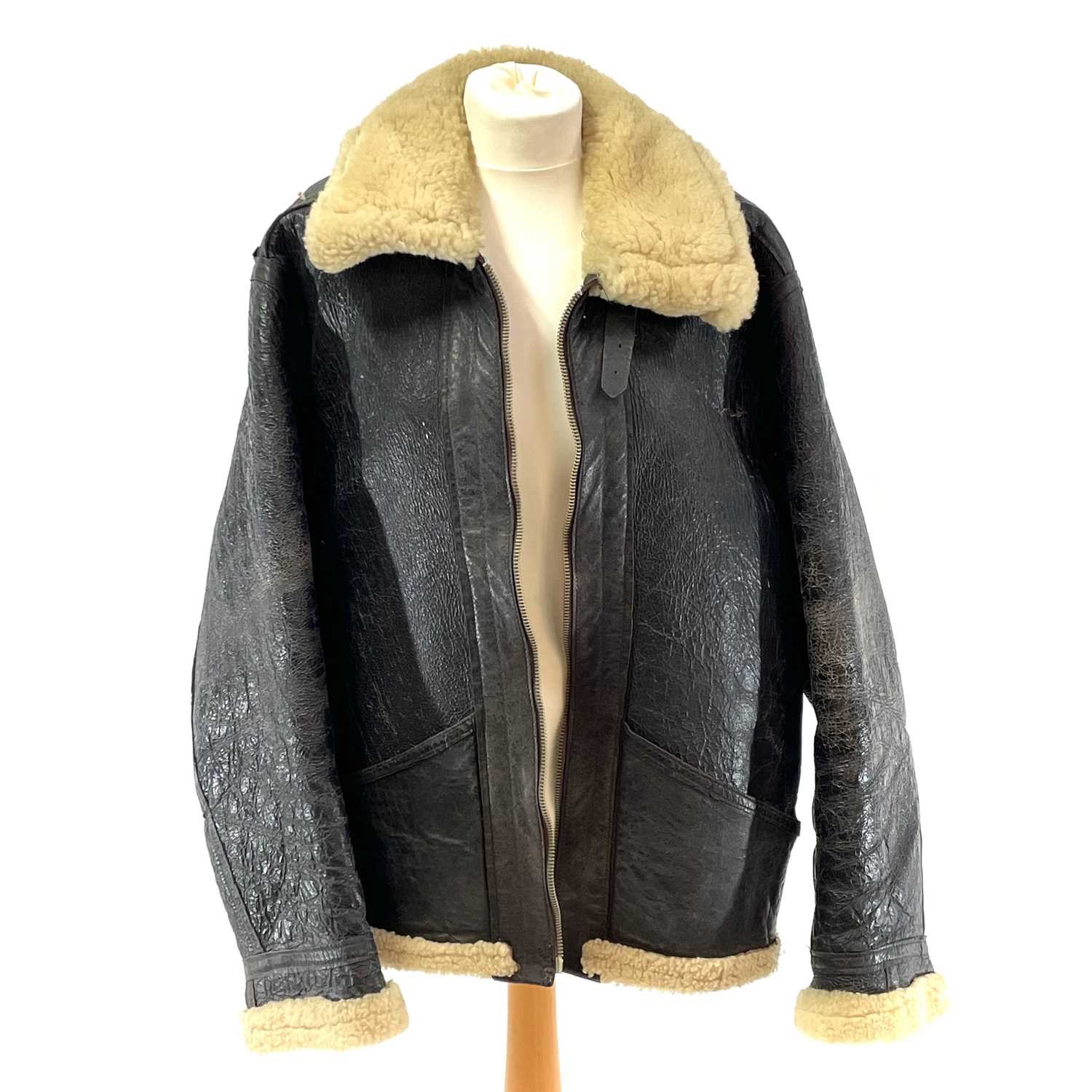 Lot 93 - A Second World War RAF black leather and sheepskin flying jacket.