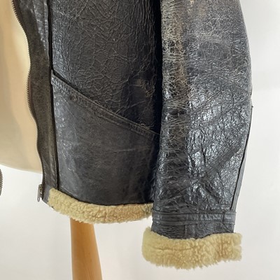 Lot 93 - A Second World War RAF black leather and sheepskin flying jacket.